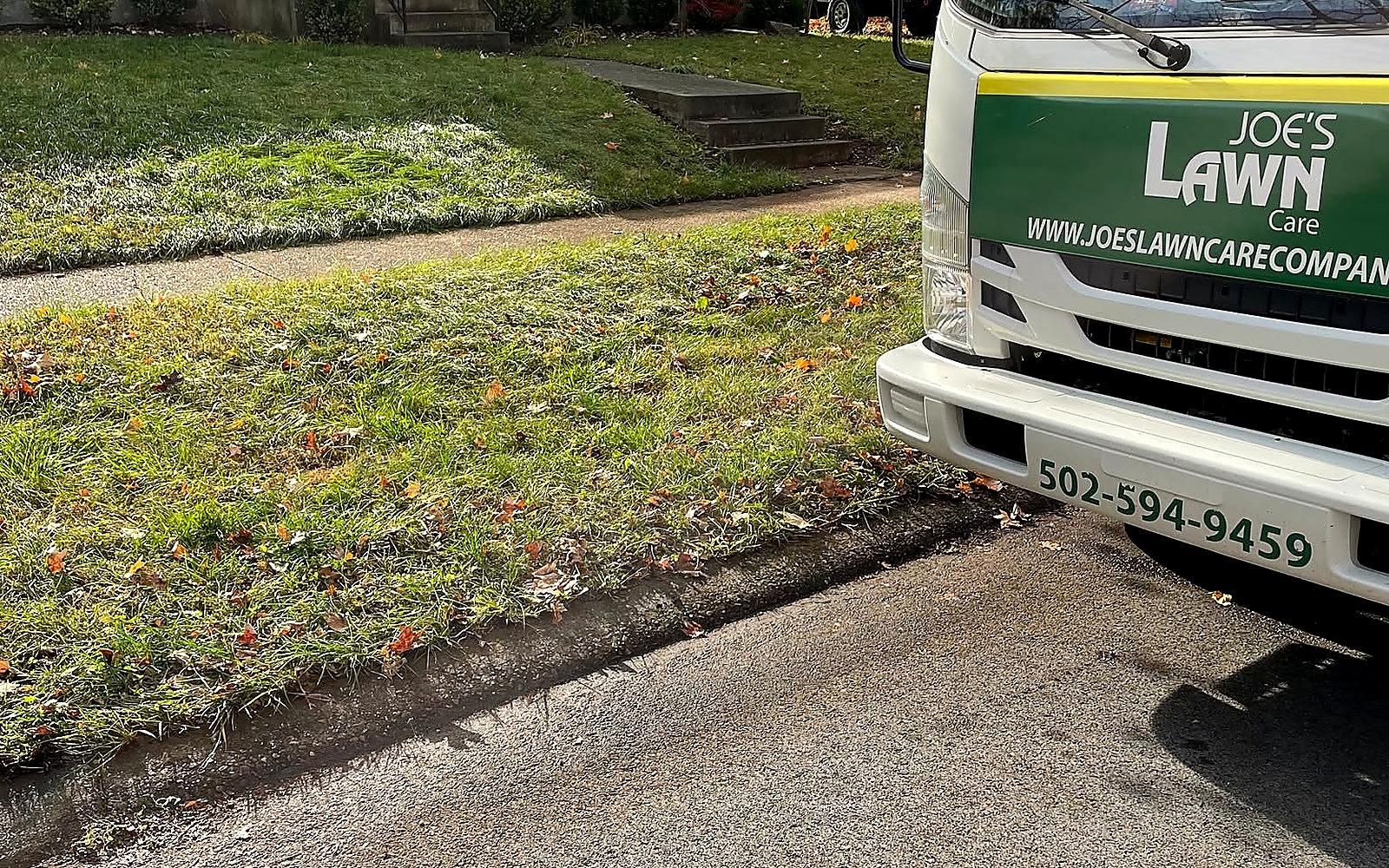 Joe's Lawn Care truck at a Louisville residential property